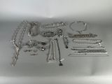 a lot of silver jewelry on the table