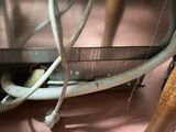 a close up view of a machine with a hose attached to it