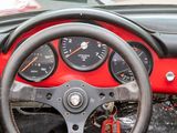 a steering wheel and gauges in the dashboard of a car