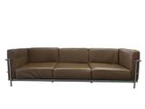 brown leather sofa with chrome legs and armrests on a white background