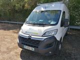 a white van that is parked on the side of the road