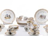 a lot of plates and cups that are sitting on a table