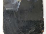 an image of a metal plaque mounted to the side of a wall