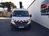 a white van that is parked in front of a building