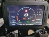 a motorcycle dashboard with a digital display on it