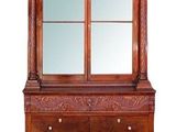 une photo d'une commode surmontée d'un miroir