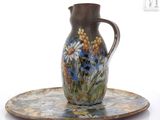 a picture of a vase and a plate on a white background