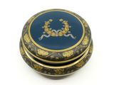 an image of a blue and gold box sitting on top of a white surface