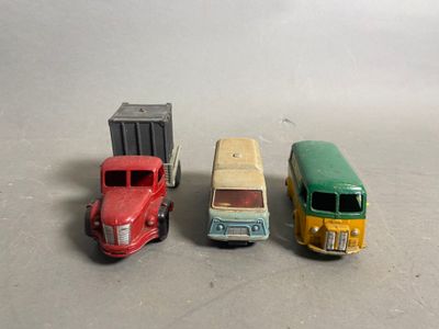 three toy trucks sitting next to each other on a table