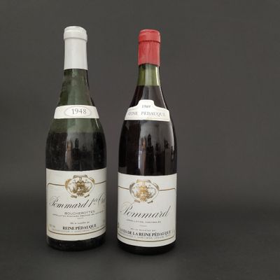 two bottles of wine sitting next to each other on a table