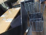 a basket that is hanging from the side of a table