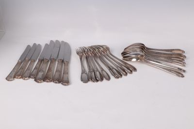 a lot of silverware on a white table