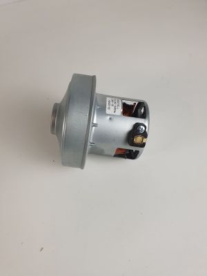 un gros plan d'un petit moteur posé sur une surface blanche