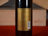 a bottle of wine that is sitting on a table