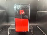 a red phone sitting on a clear stand in a room