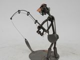 metal sculpture of a man holding a fishing rod and a fish
