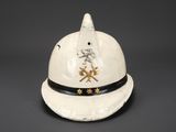 an old white helmet with a skull and cross bones on it