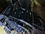 a pile of laptops sitting on top of a table