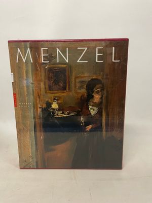 a book with a picture of a man sitting at a table