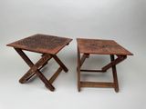 two small wooden tables with intricate designs on them on a white background