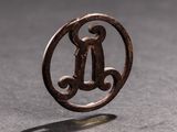 a ring with a letter in the middle of it