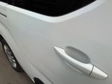 a close up of a car door handle on the side of the car