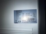 a picture of a white refrigerator with a label on it