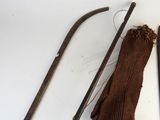 a cane, a pair of gloves, and a pair of scissors on a table