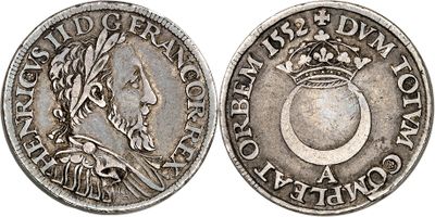 a silver coin with a crown on top of it