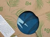a brown box with a blue and green design on it