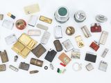 many different types of lighters and lighters on the table