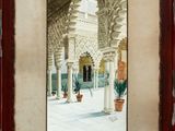 an image of a painting of a courtyard with potted plants