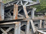 a pile of metal beams stacked on top of each other