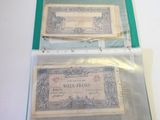 two old bank notes sitting in a plastic bag
