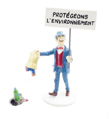a figurine of a man holding a protest sign
