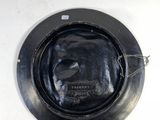 a picture of a black plate on a white table