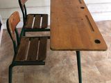 a wooden table with two chairs and a bench