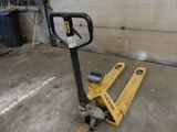a fork lifter that is sitting in a garage
