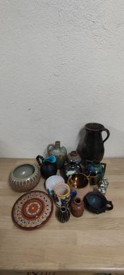 many different types of pottery on the table