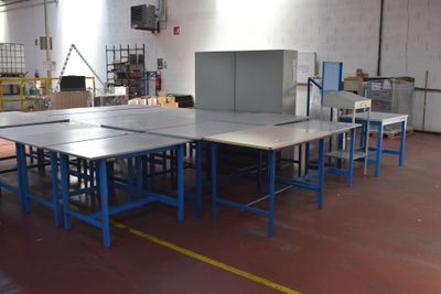 a room with tables and chairs in it that are empty