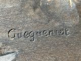 a close up of a piece of wood with writing on it
