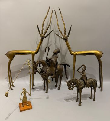 une statue représentant un homme à cheval, à côté d'un groupe d'animaux
