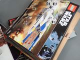 a box of lego star wars sets on a table