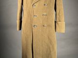 an image of a man ' s coat on a mannequin mannequin stand