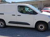 a white van that is parked in a parking lot