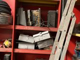 a ladder leaning against a red shelf in a garage