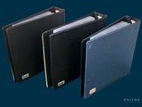 three binders that are sitting next to each other