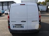 a white van that is parked in a parking lot