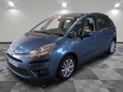 a picture of a blue citrole parked in a garage