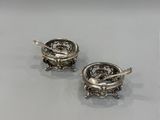pair of silver plated earrings with a dragon and flower design